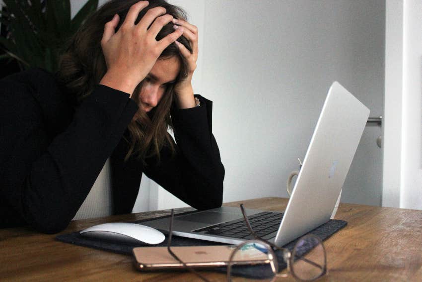 tired woman sitting over laptop