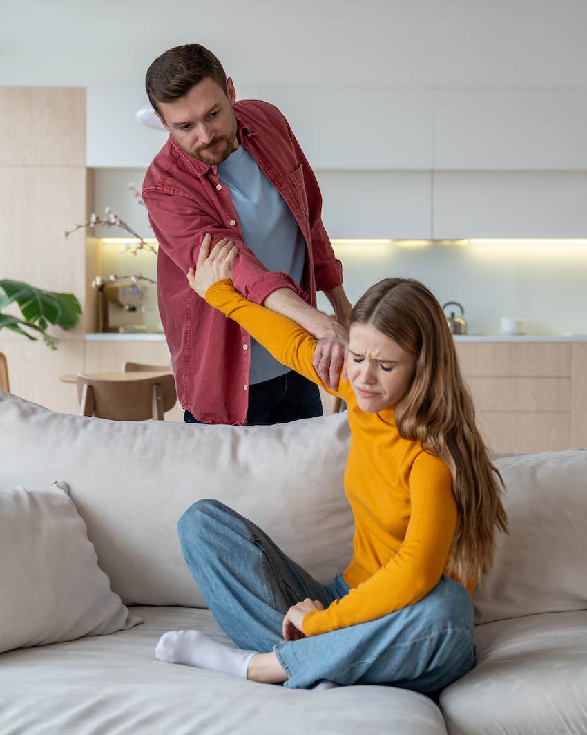 Tense moment married couple as engage in heated argument 