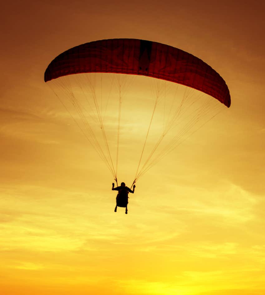 paragliding into the sunset