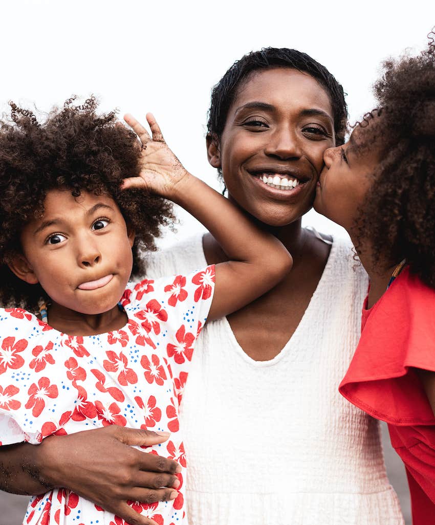 happy mom and two active daughters.