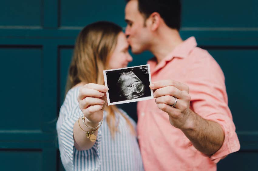 couple holding sonogram