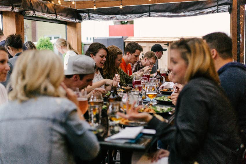 group of people eating at a restaurant