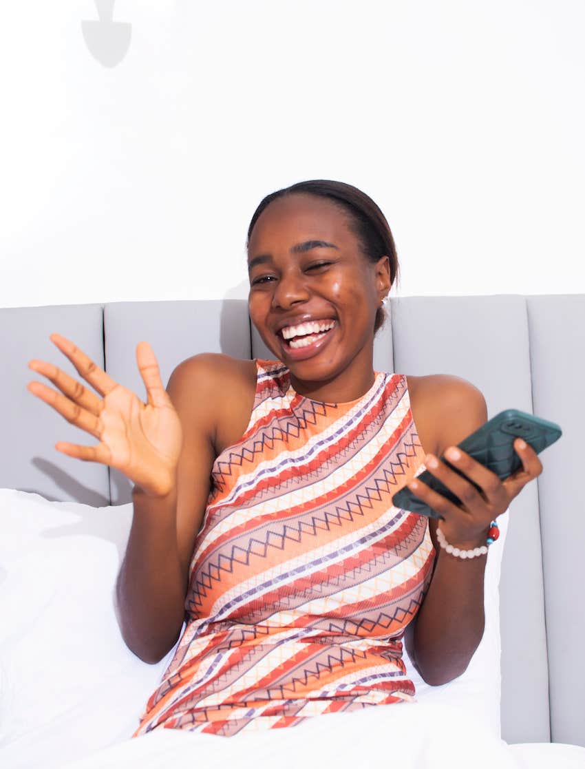 Happy Smiling girl with her phone
