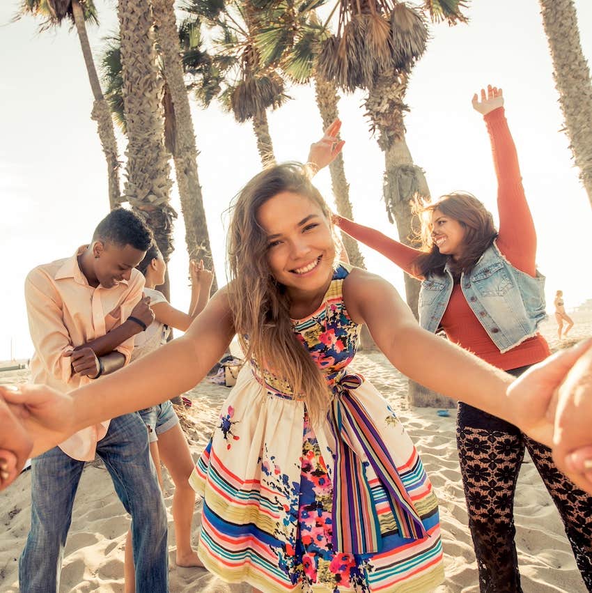 friends having fun outdoor on beach