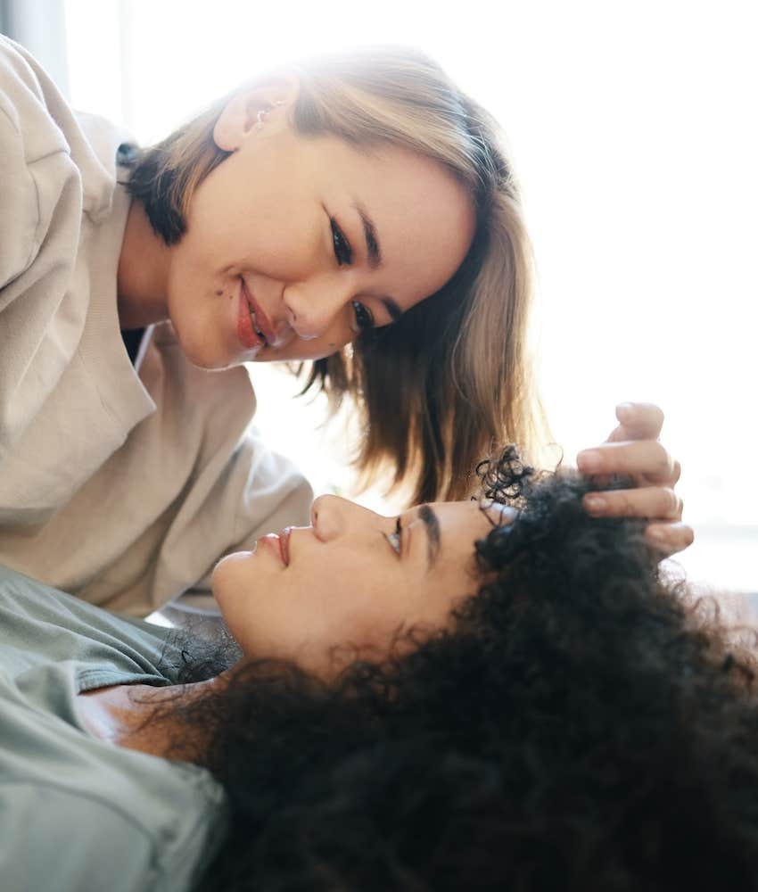 couple with intimate moment on bed 