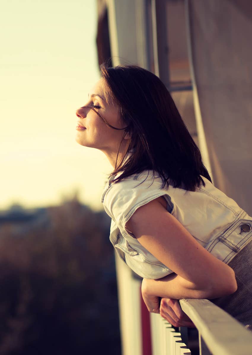 feeling content leaning off the balcony for fresh air