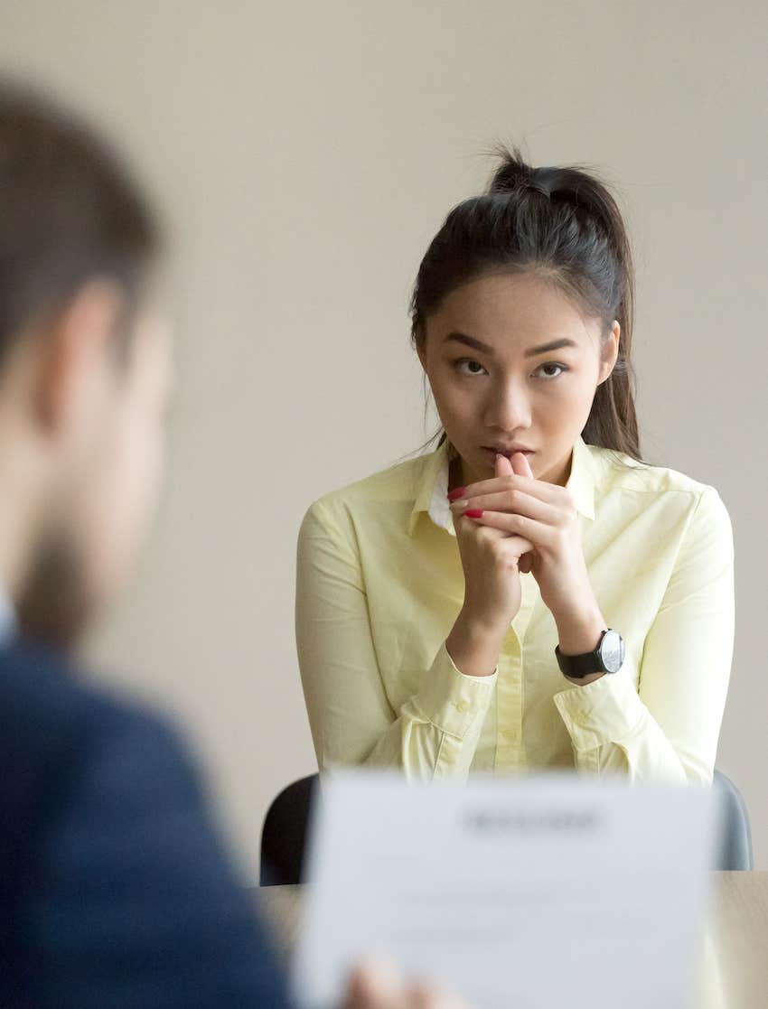 tension while she waits for him to sign the paper