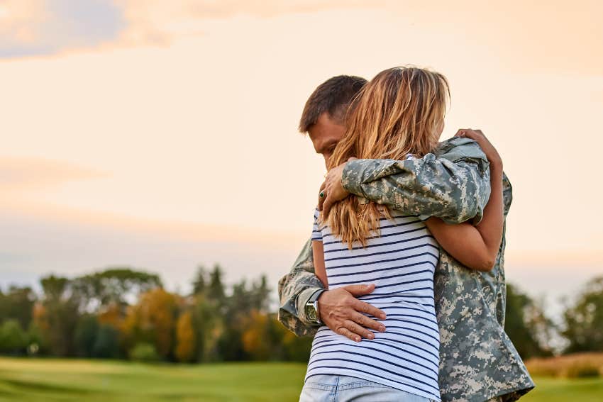 u.s. soldier hugging woman