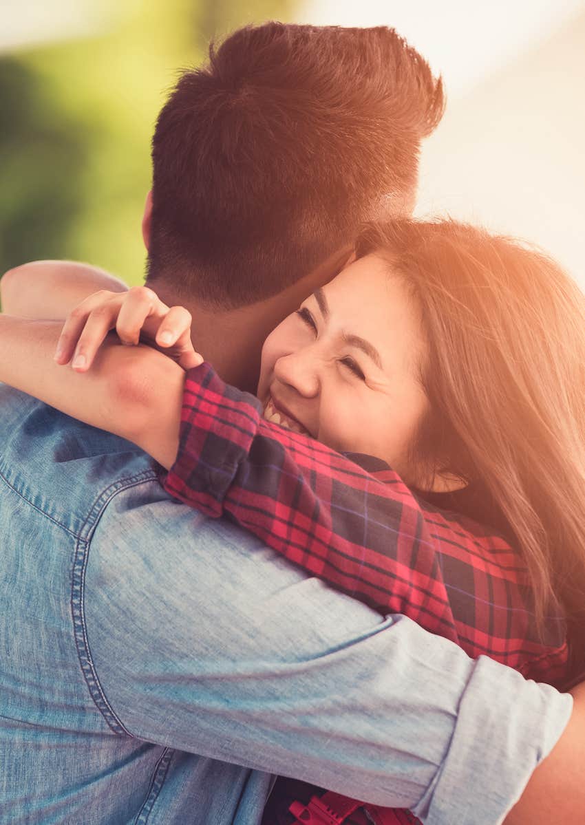 happy hugging on street 