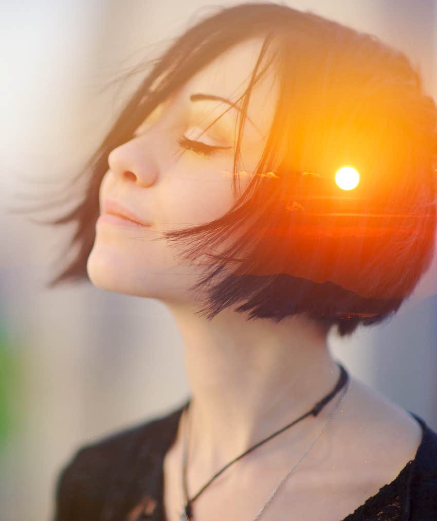 double exposure of peaceful woman and sun rise