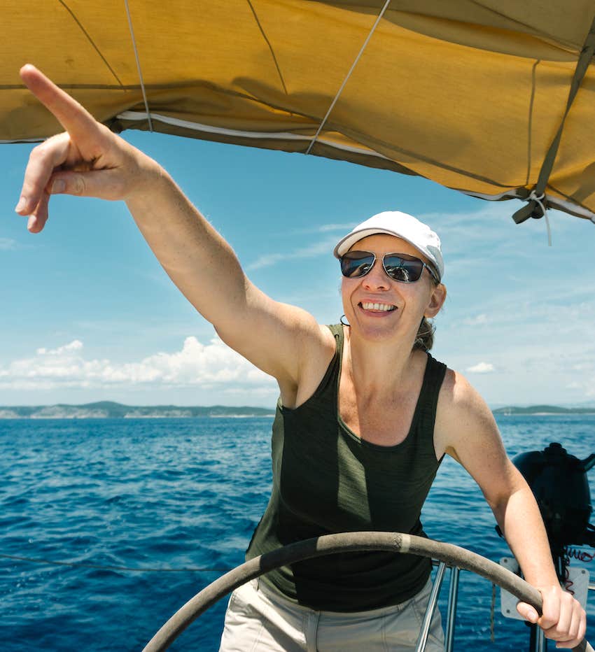 skipper on the steering wheel of a yacht