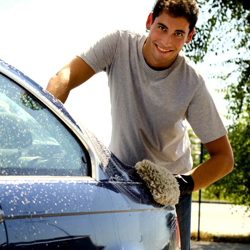 young man washing his car