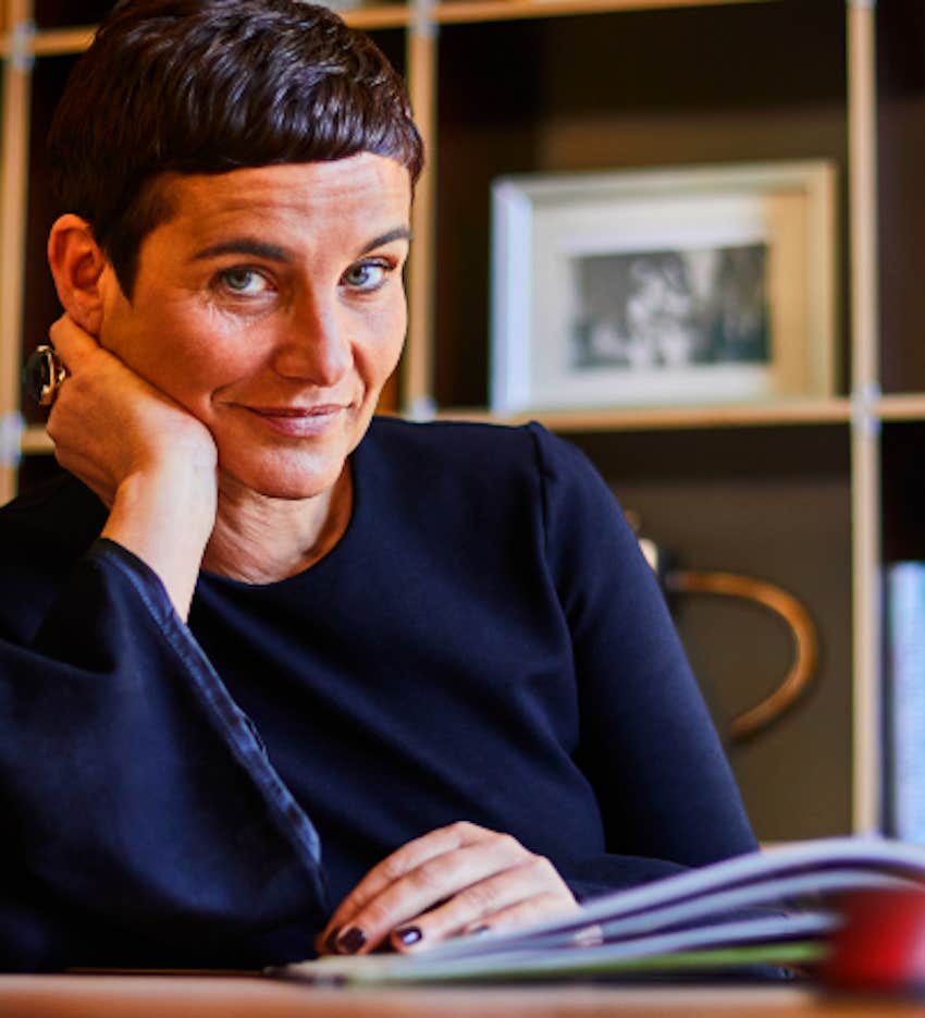 woman at desk with book