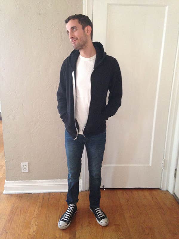 man in white t-shirt, blue jacket and jeans