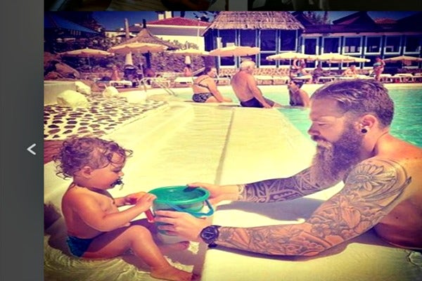 Dad and daughter at the pool.