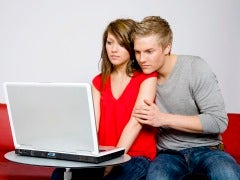 Couple looking at laptop screen