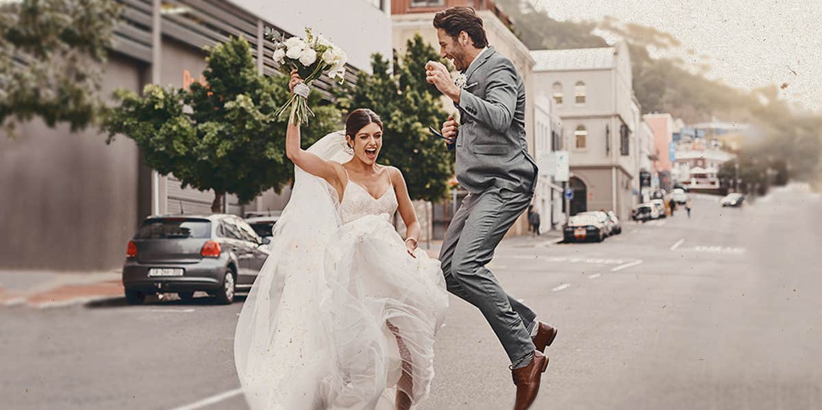 the bride and the groom dancing on road