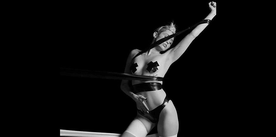 Miley Cyrus naked except for pasties and pantyhose in 'Tongue Tied' Miley Cyrus naked except for pasties and pantyhose in 'Tongue Tied'