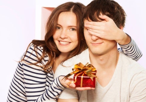 couple exchanging Christmas gifts