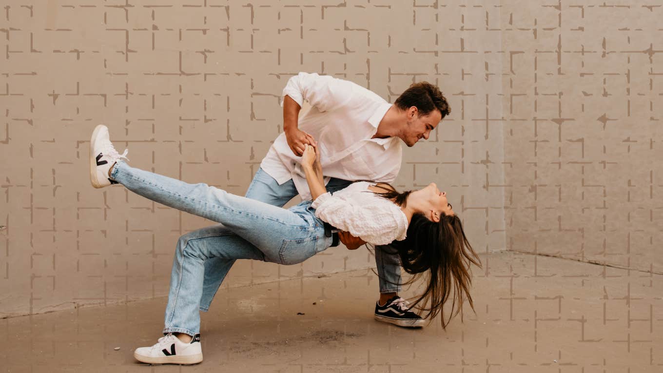 Man dipping woman back while dancing 