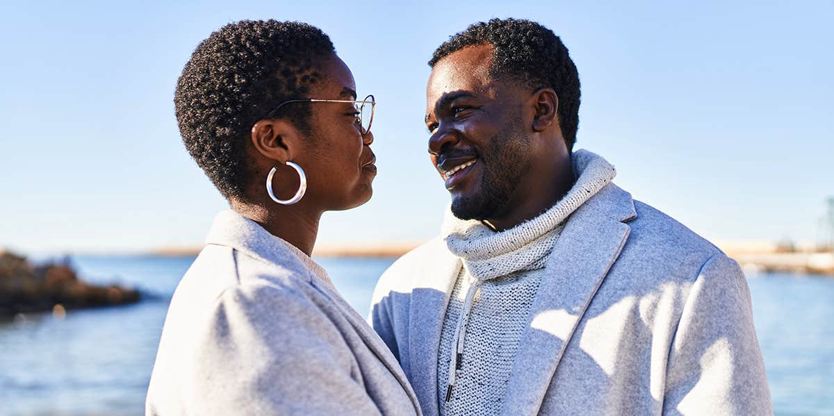 husband and wife smiling at each other