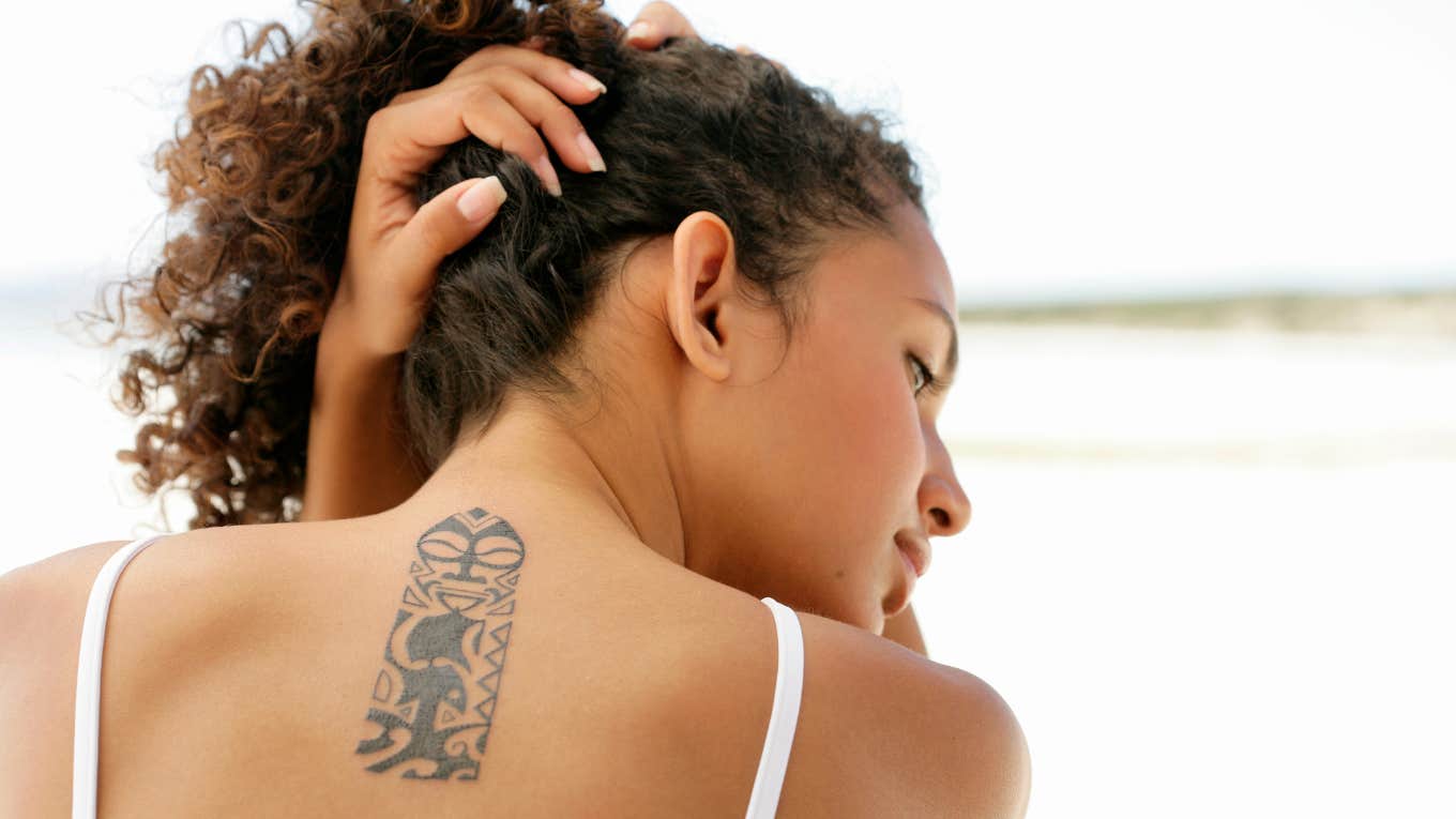 Woman with neck tattoo 