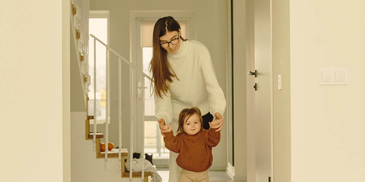 mother walking child by the hand