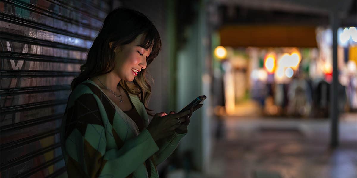 woman texting on phone