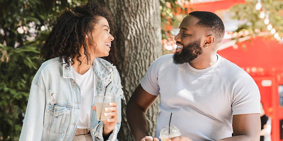 man and woman flirting on date