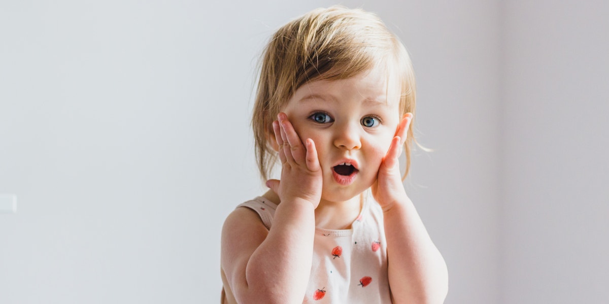 toddler girl making face