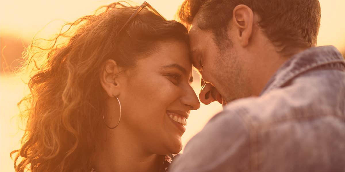 couple embracing and smiling