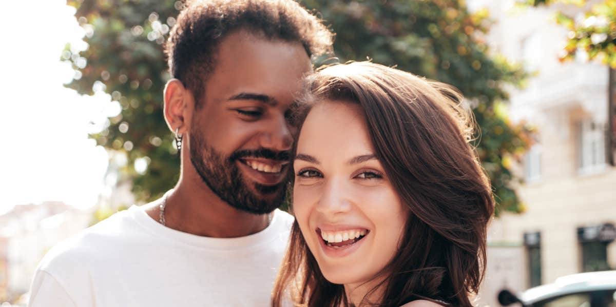 man and woman smiling