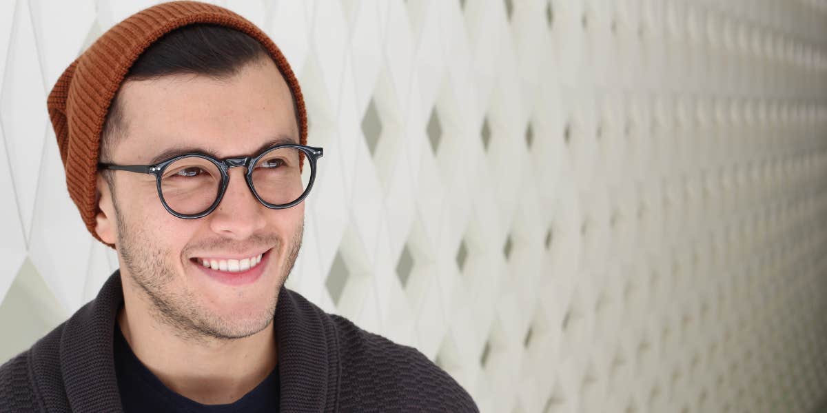 man in glasses smiling