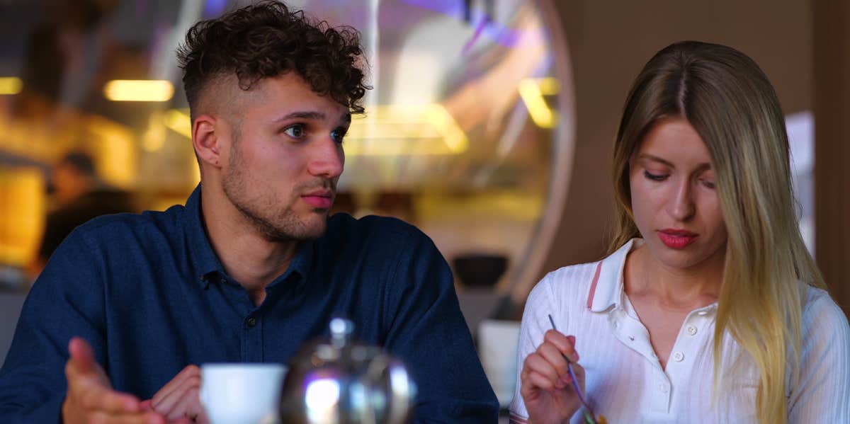 couple talking on date eating dinner