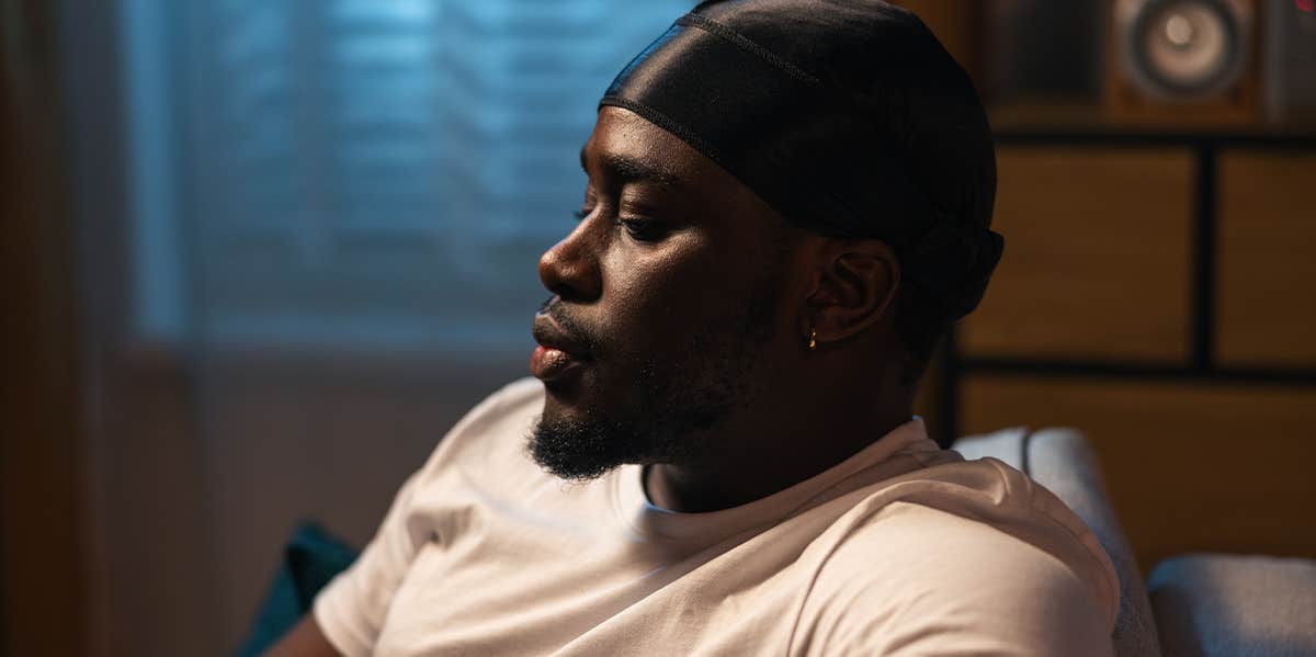 10 Subtle Signs A Man Is Carrying Sadness Over Your Breakup sad guy sitting alone at home