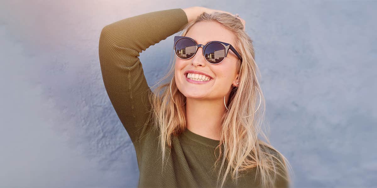 10 Encouraging Signs You're No Longer In Love With Your Ex woman smiling