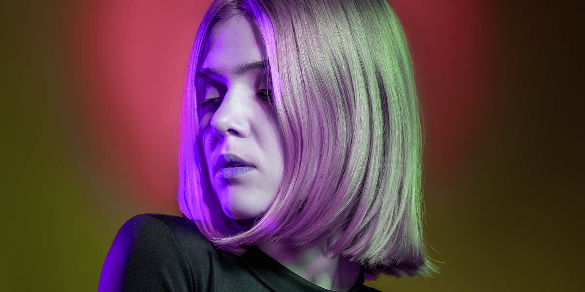 Signs You — Not Him — Are The Toxic One In The Relationship woman in neon light
