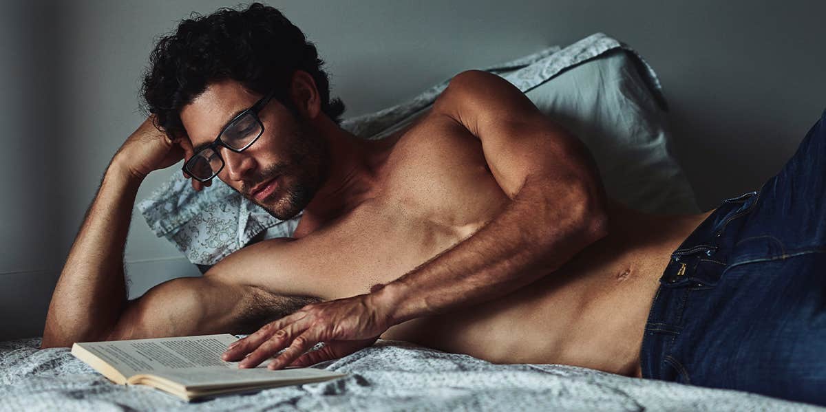 smart man reading in bed