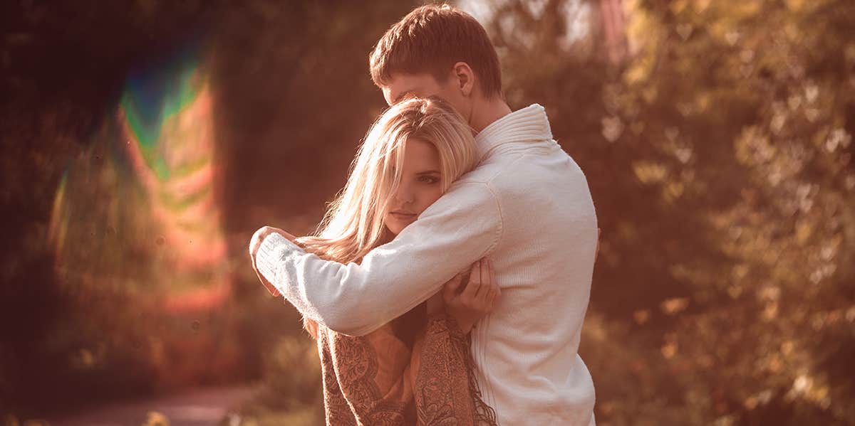 10 Subtle Signs He's Nowhere Near Ready To Marry You man hugging woman