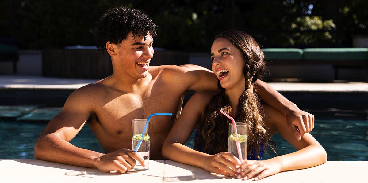 Guys Don't Care About These 10 Things That Women Think They Care About couple laughing at the pool
