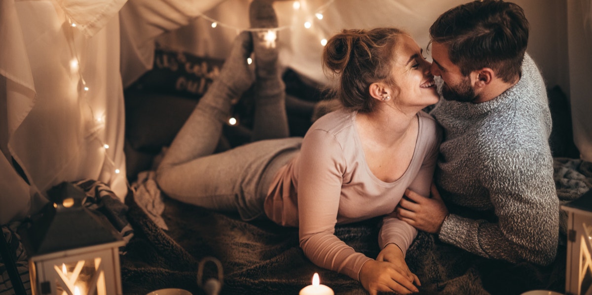 man and woman kissing