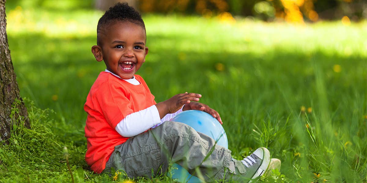 little boy playing outside