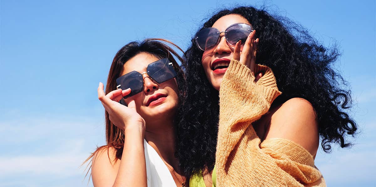 two girl friends wearing sunglasses