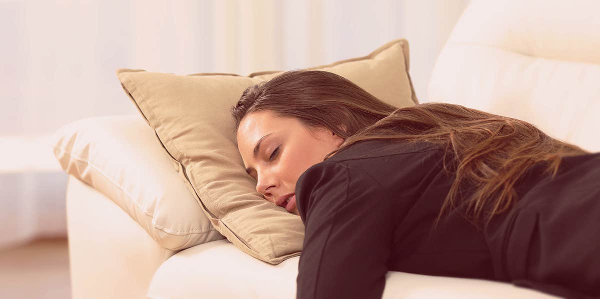 10 Ways To Self-Sabotage Your Life, According To A Therapist Of 14 Years woman sleeping on the couch