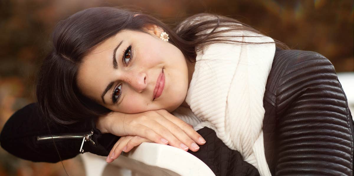happy woman resting on bench