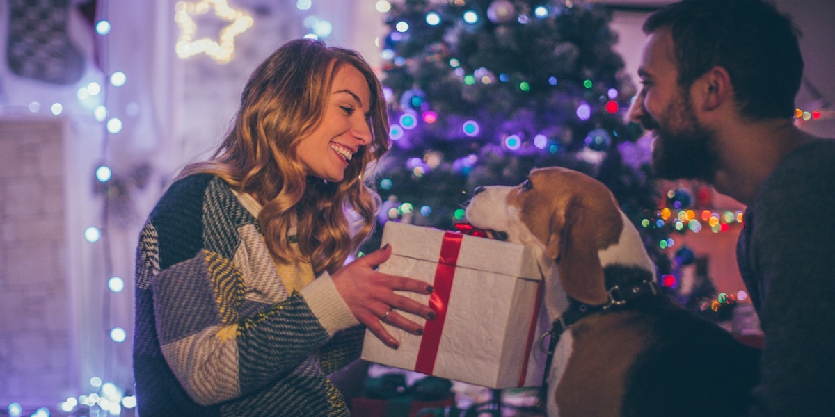 woman opening christmas gifts