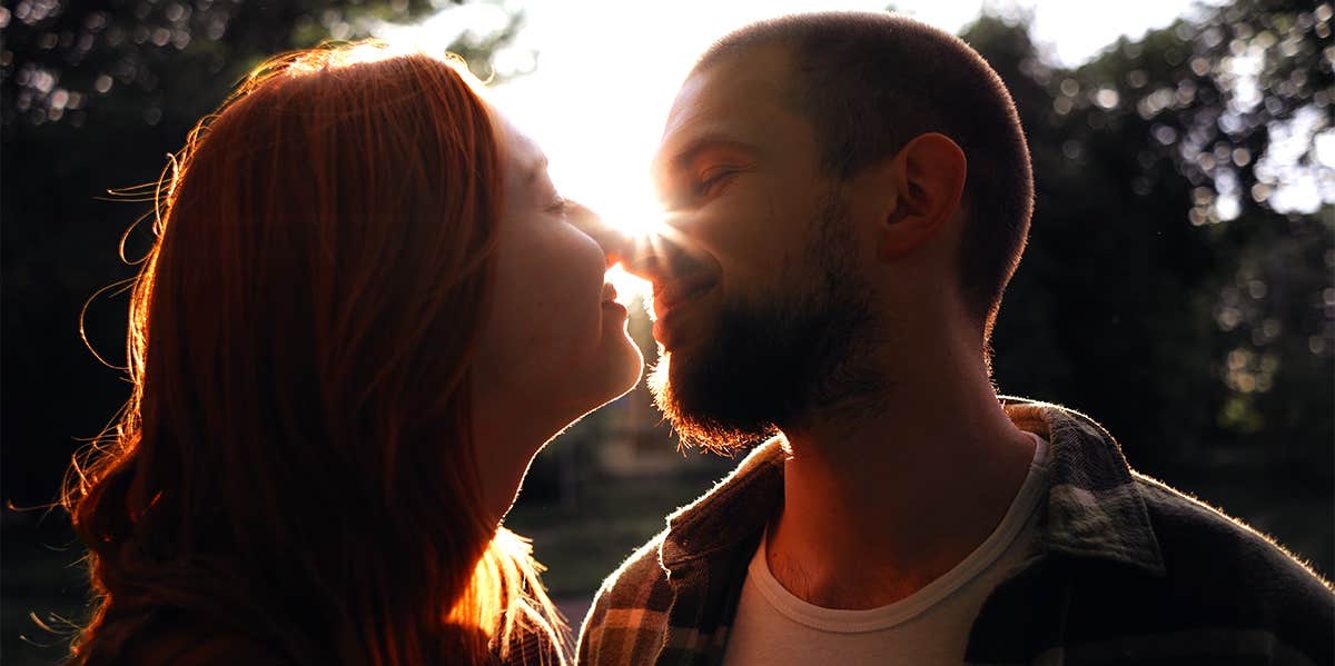 man and woman about to kiss