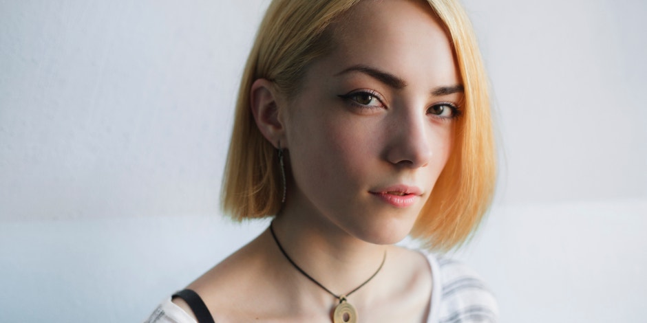 16 Signs You (Or Someone You Know) Has Conversion Disorder woman staring at photographer