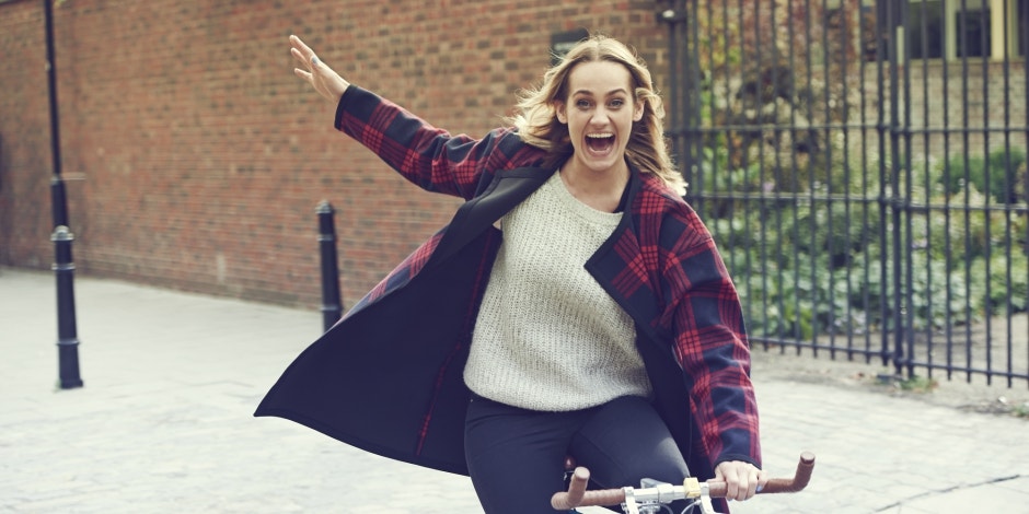 woman skipping with jacket on