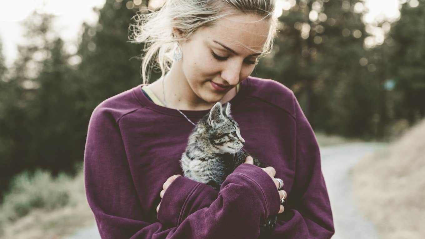 woman holding a kitten 